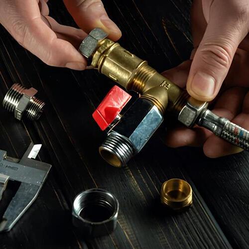 plumber working with gas line equipment